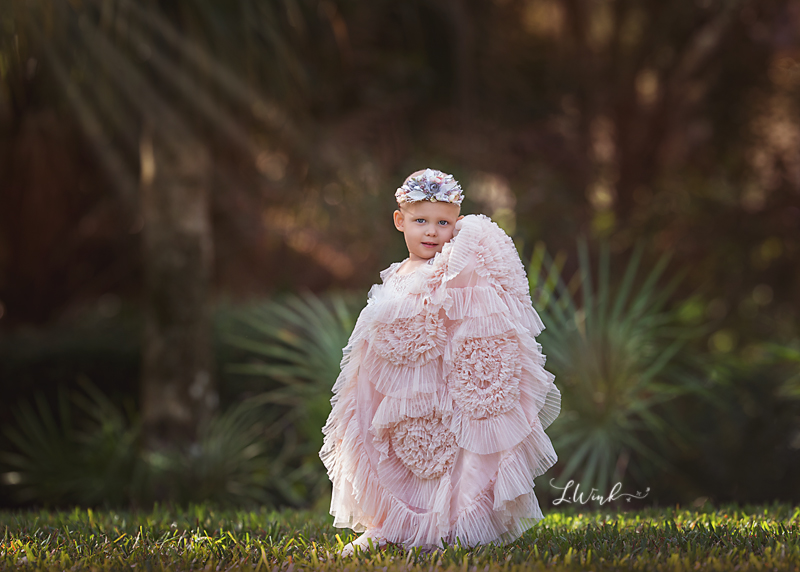  girl with leukemia wearing pink princess dress and crown