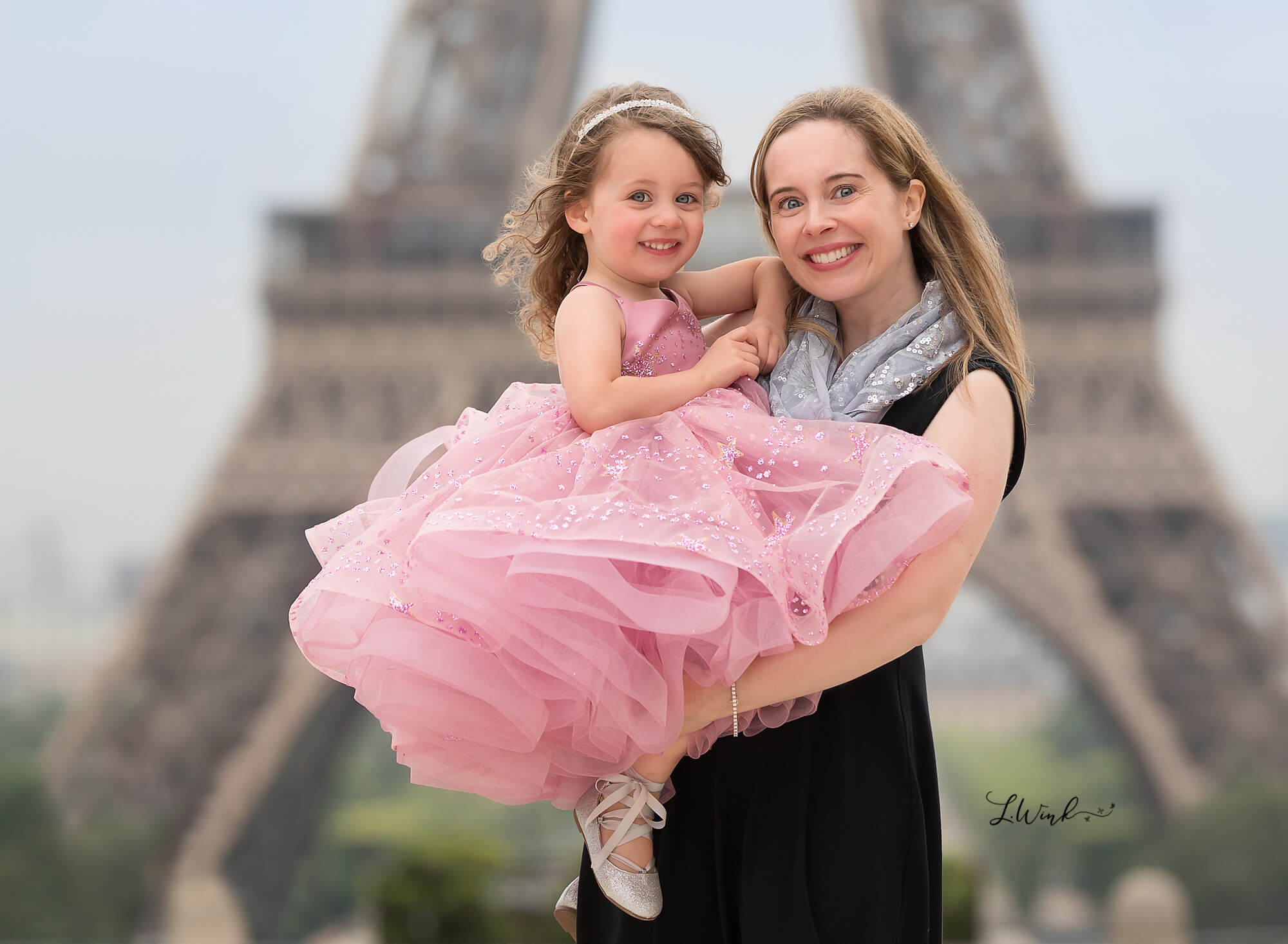 Mother and daughter in pink dress at Tower Eifflel in France