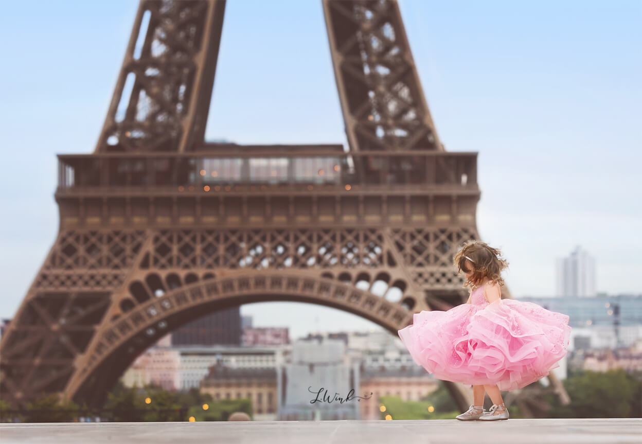 Eifell Tower with little girl twirling