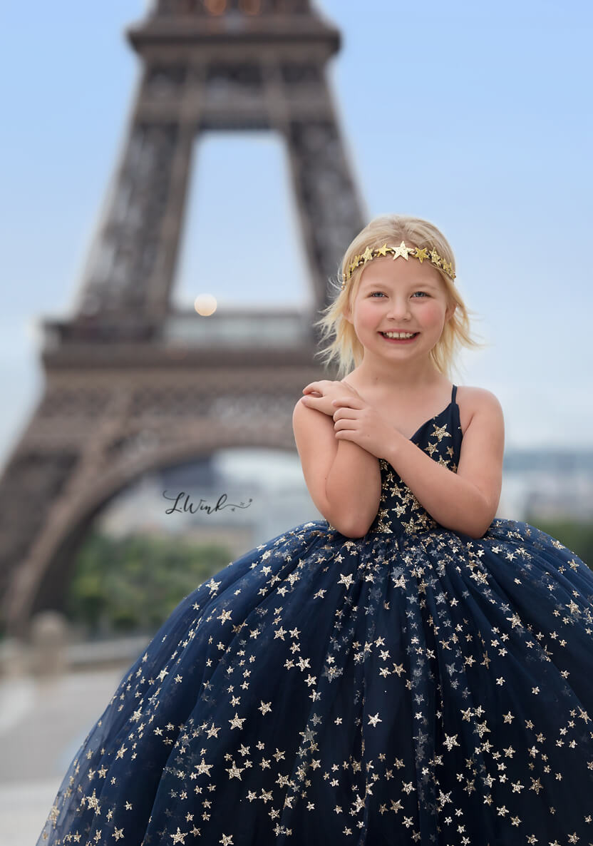 Girl in Paris in blue star dress