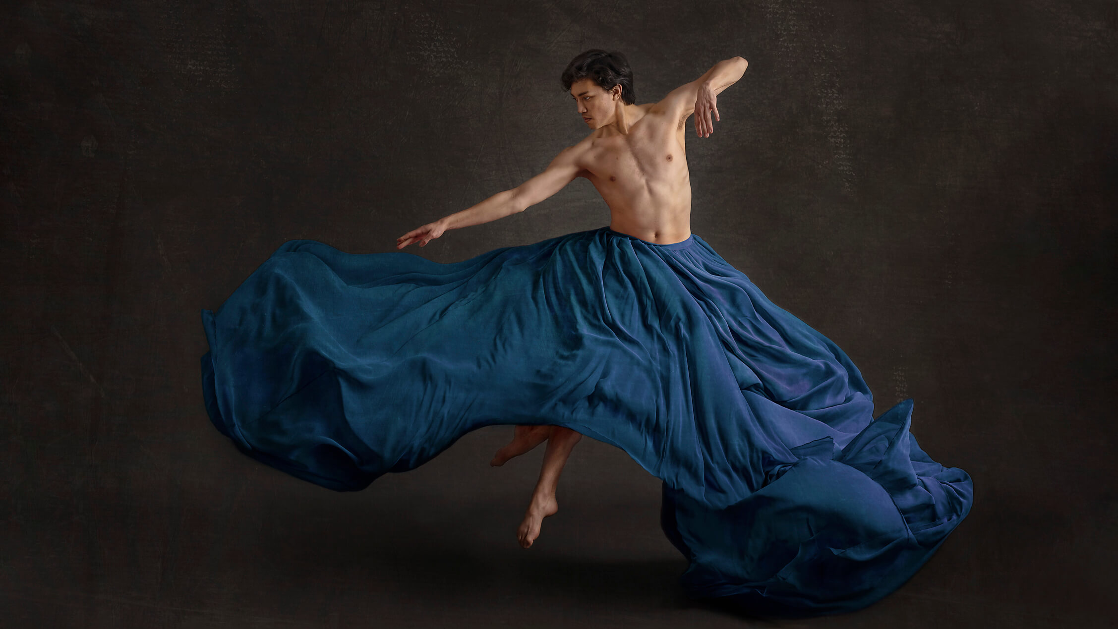 Palos Verdes, CA dance portrait of a man in a blue skirt