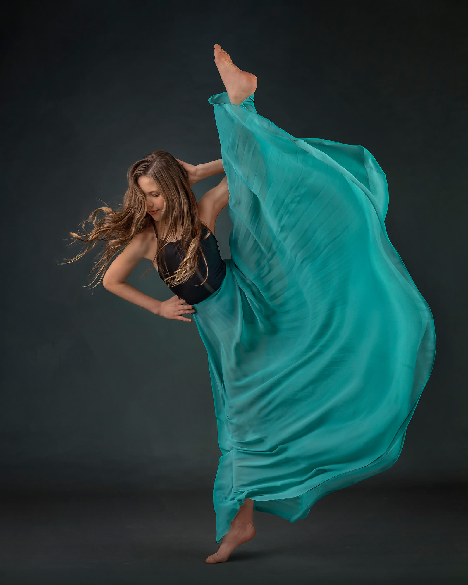 Young Torrance dancer pose in a teal skirt