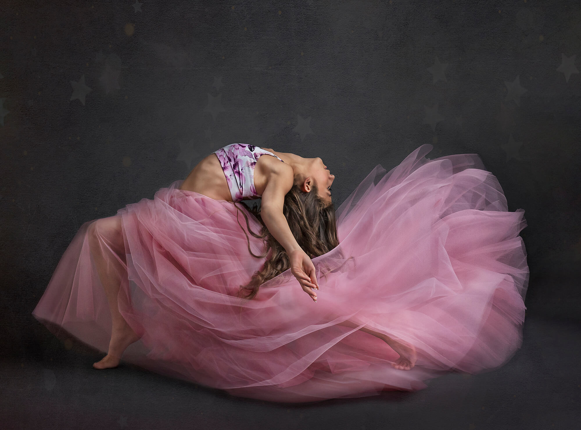 OC dancer bending back in her pink tulle skirt
